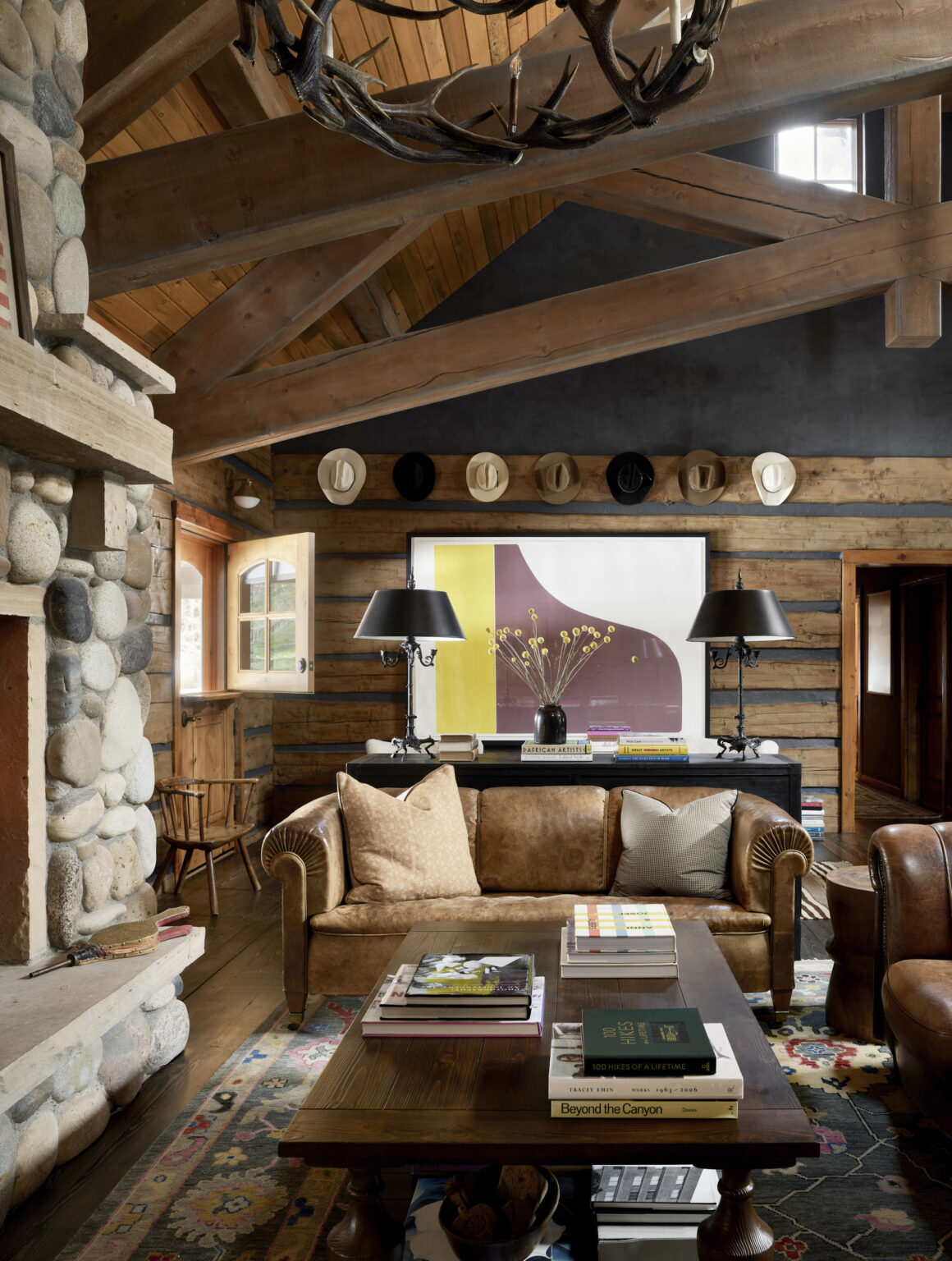 The interiors on the charming cabin are sophisticated and moody. Aspen architectural photographer Dallas + Harris photographed this project for Kathy Kroger Interiors.
